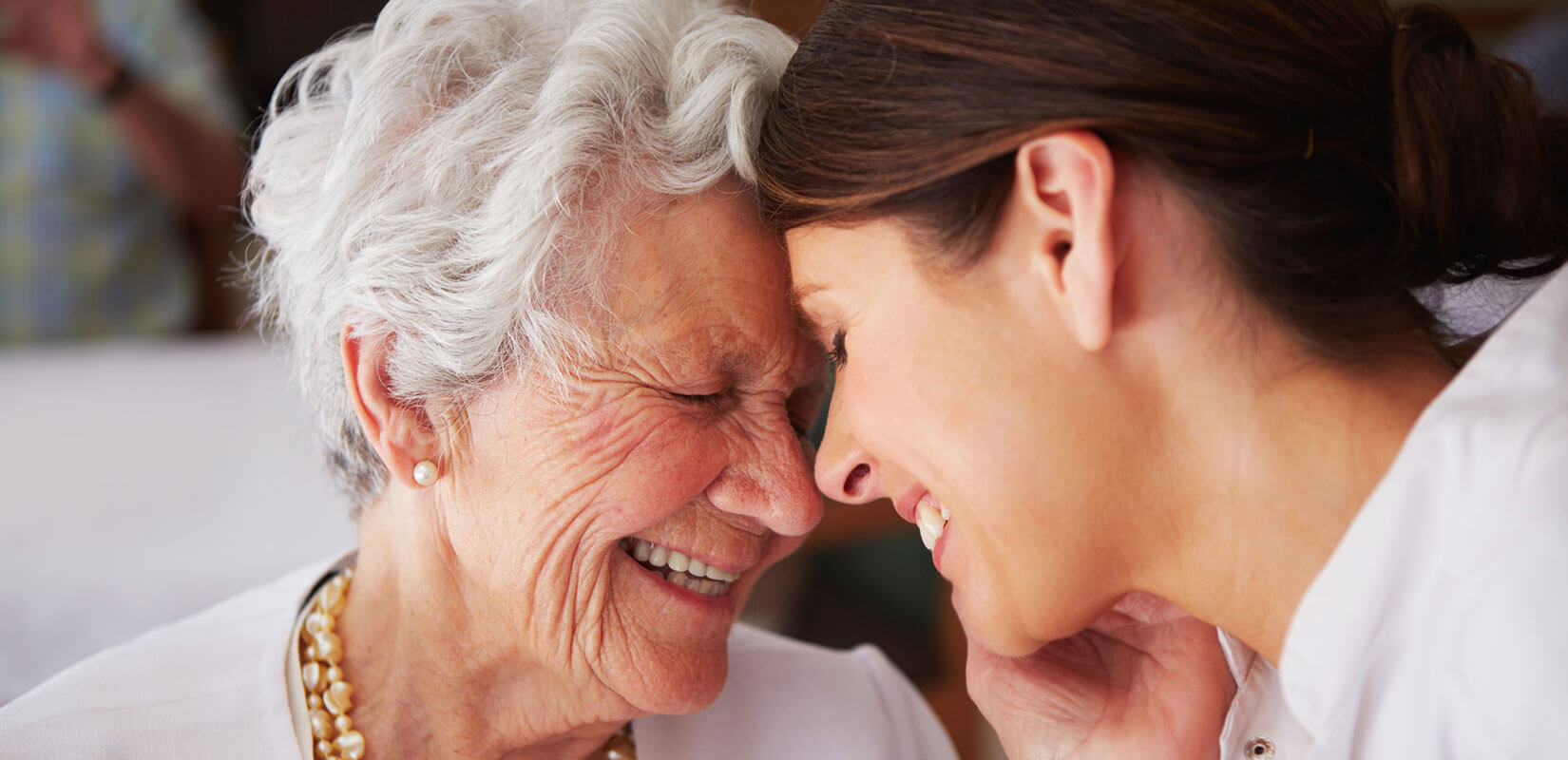 woman smiling with elderly woman