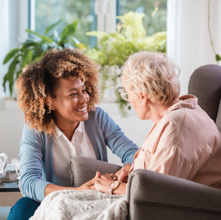 Employee comforting a senior woman